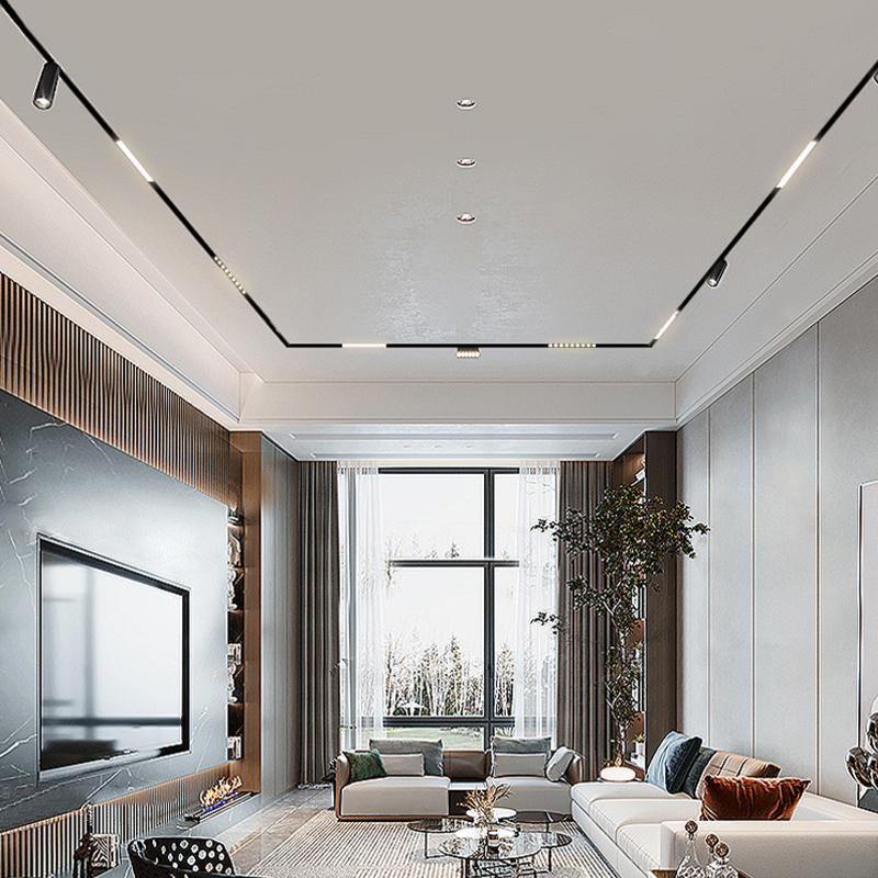 Recessed magnetic track framing a high living-room ceiling with spot and linear heads