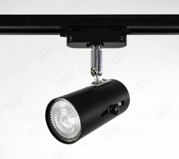 Black GU10 track head with a replaceable lamp, mounted on a rail adaptor